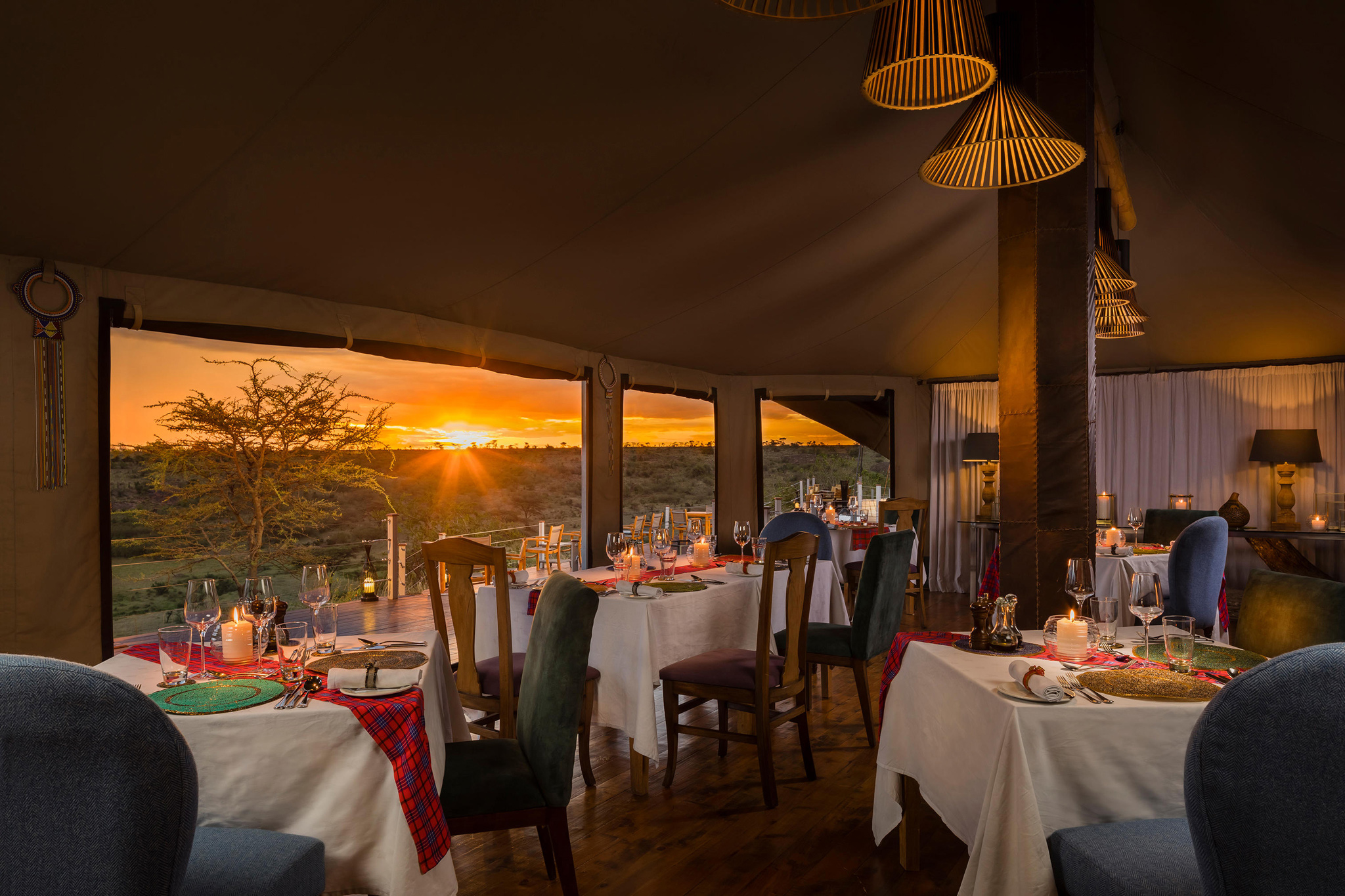 inside the dining area of Mahali Mzuri Kenya Masai Mara at sunset