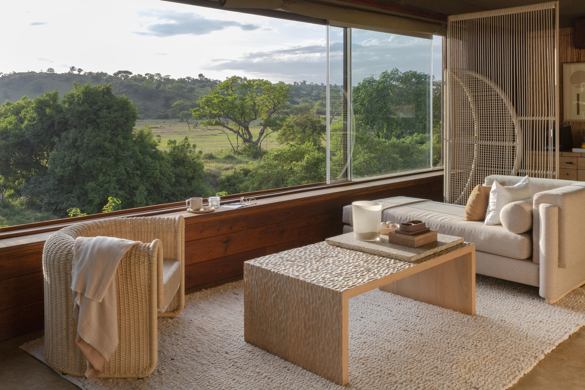 lounge and viewing area in a room of Singita Faru Faru lodge Serengeti