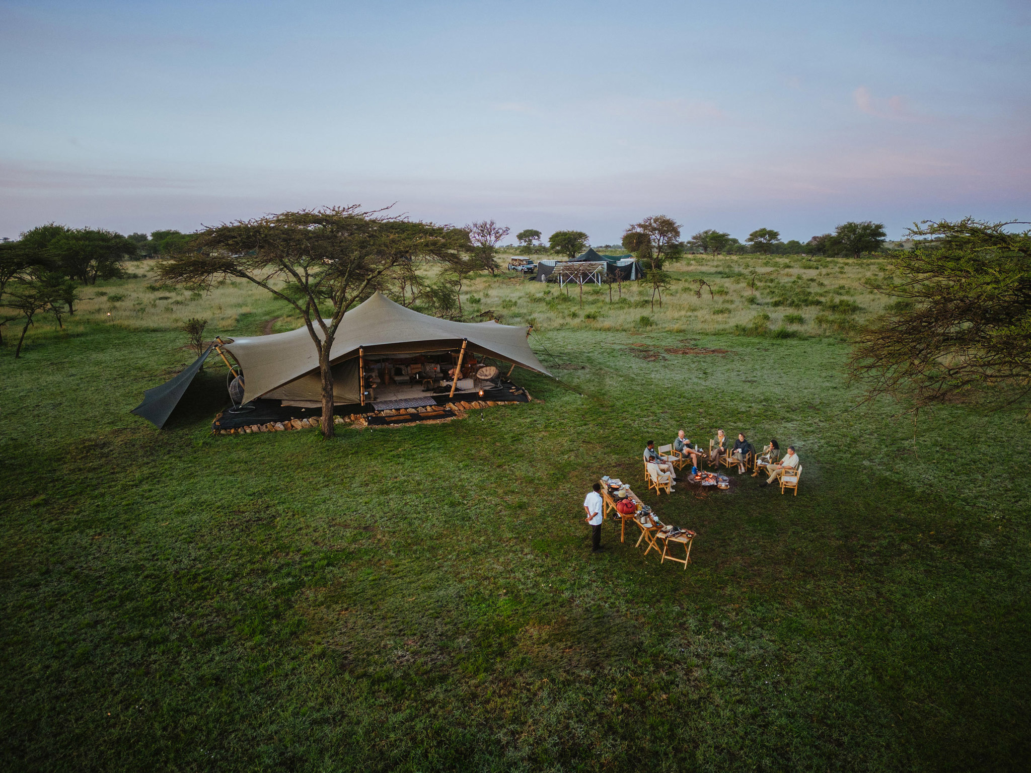 aerial view of camp with fireplace by Wilderness Usawa tented camp Serengeti