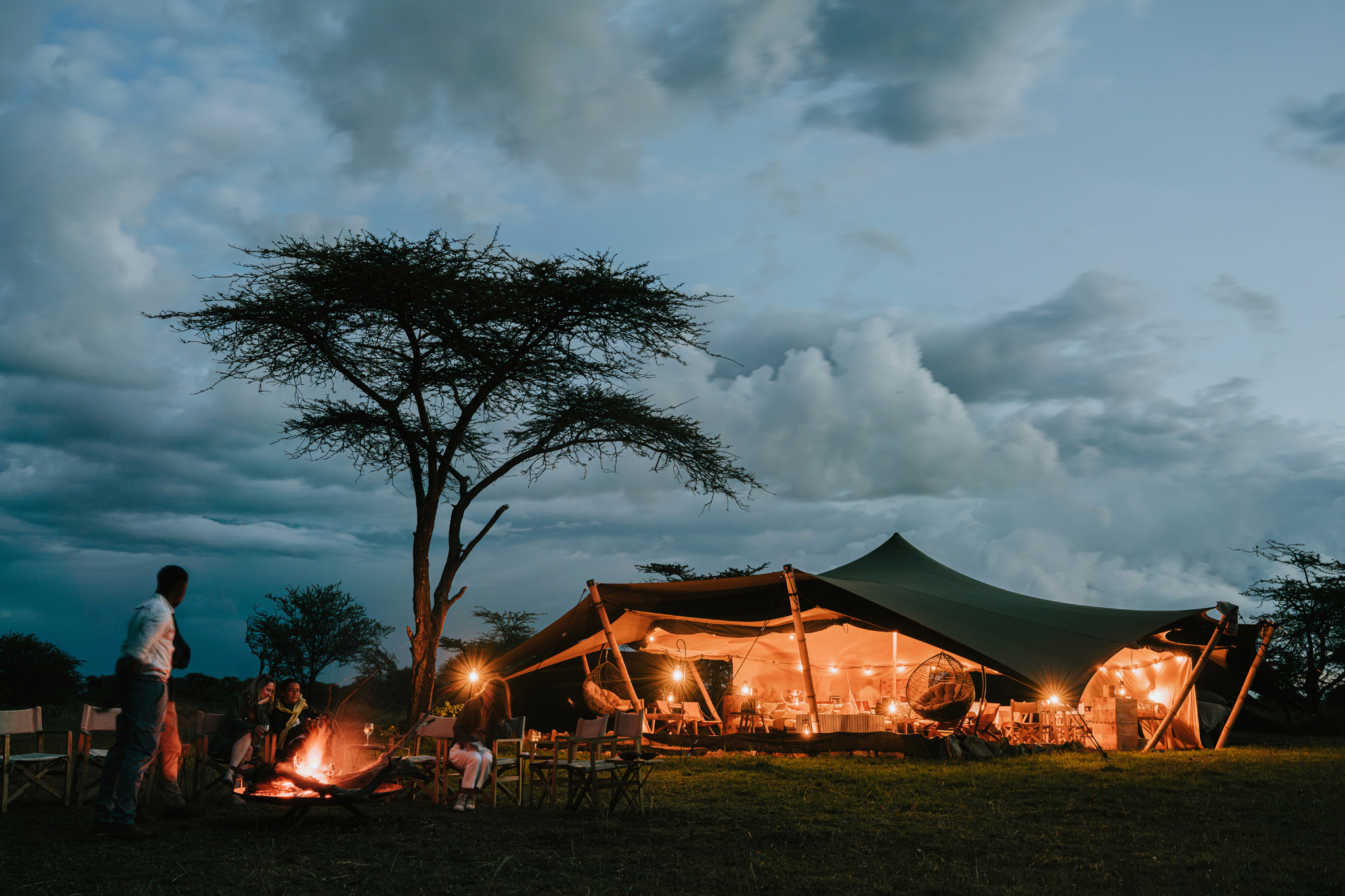 evening view with fire outside by Wilderness Usawa tented camp Serengeti